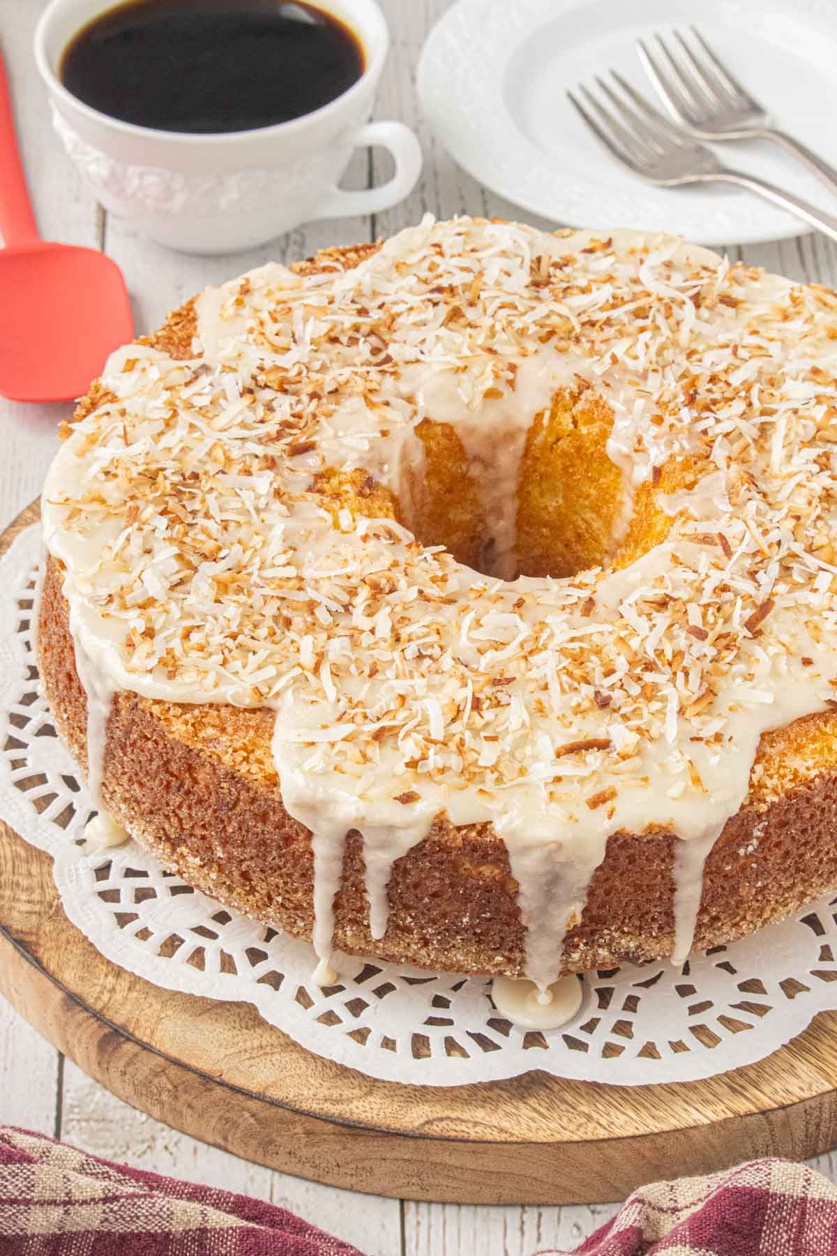 Louisiana crunch cake with toasted coconut glaze served with a cup of coffee