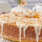 Homemade Louisiana crunch cake topped with creamy vanilla glaze and toasted coconut