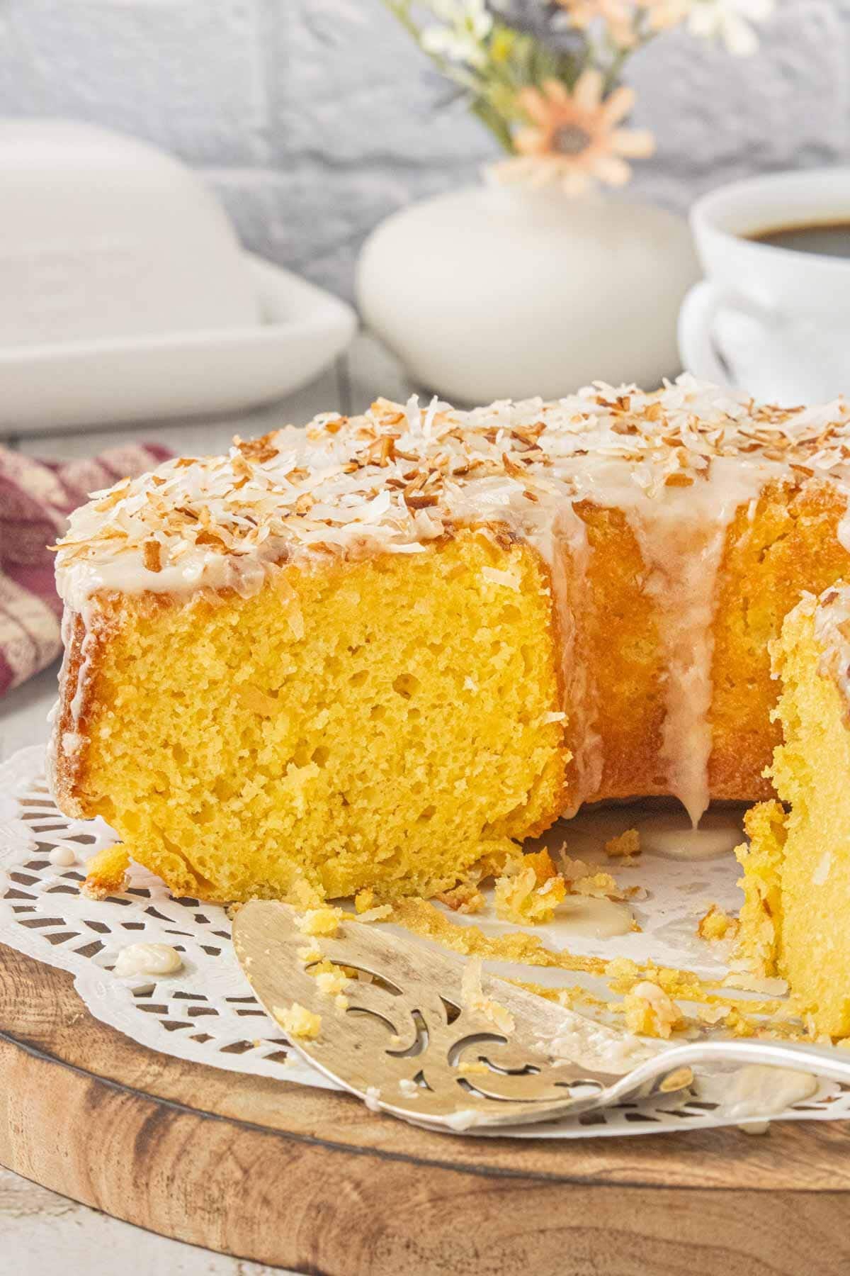 Louisiana crunch cake with a slice removed to show the moist yellow cake crumb