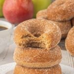 A stack of homemade apple cider donuts with text overlay for Pinterest.