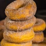 Stack of cinnamon sugar baked pumpkin donuts made with cake mix