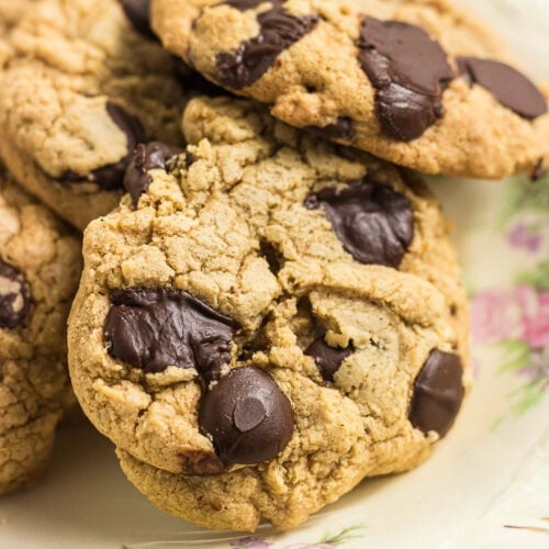 Close-up of chewy gluten-free brown butter chocolate chip cookies with large melted chocolate chips