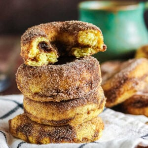 Cinnamon baked donuts coated with cinnamon sugar and filled with a brown sugar cinnamon swirl