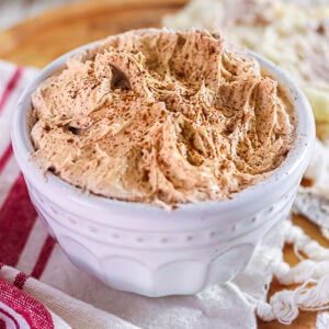 Whipped cinnamon honey butter with cinnamon and chipotle in a white bowl.