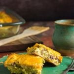 Crescent roll breakfast casserole with sausage, eggs, peppers, green chiles, and melted cheese