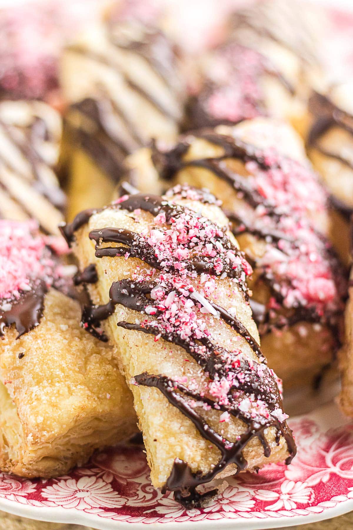 Chocolate peppermint puff pastry cookie drizzled with bittersweet chocolate and sprinkled with crushed candy canes.