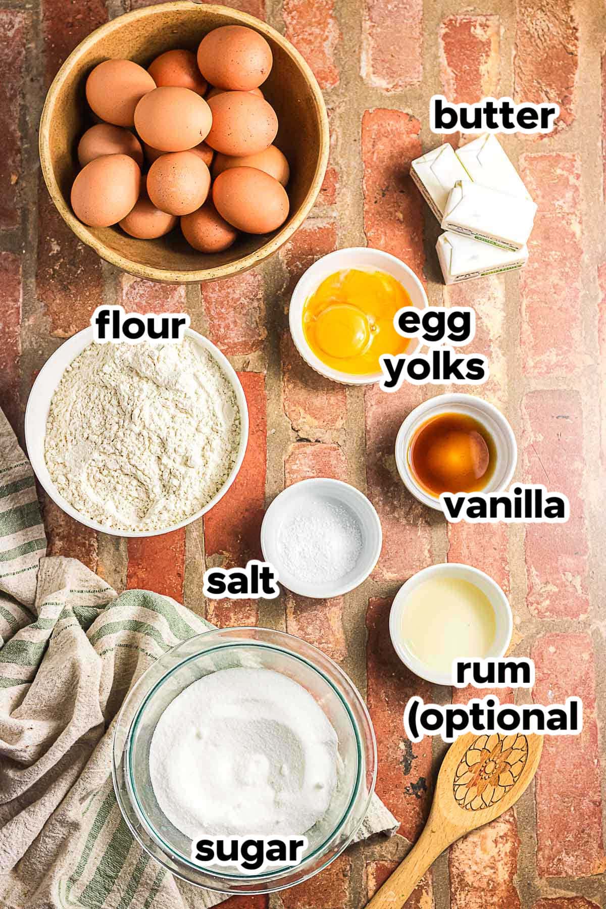 Ingredients for brown butter icebox cookies including butter, flour, sugar, egg yolks, vanilla, salt, and rum