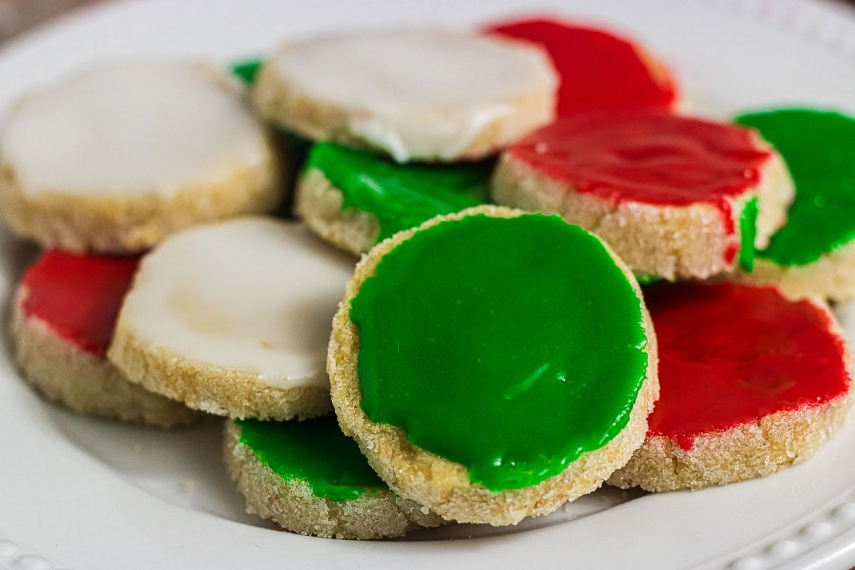 Brown butter icebox cookies decorated with red, green, and white Christmas icing
