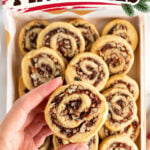 Pinterest graphic featuring old-fashioned date nut pinwheel cookies with swirls of sweet dates and chopped pecans, one cookie held above a tray, with festive red lettering.