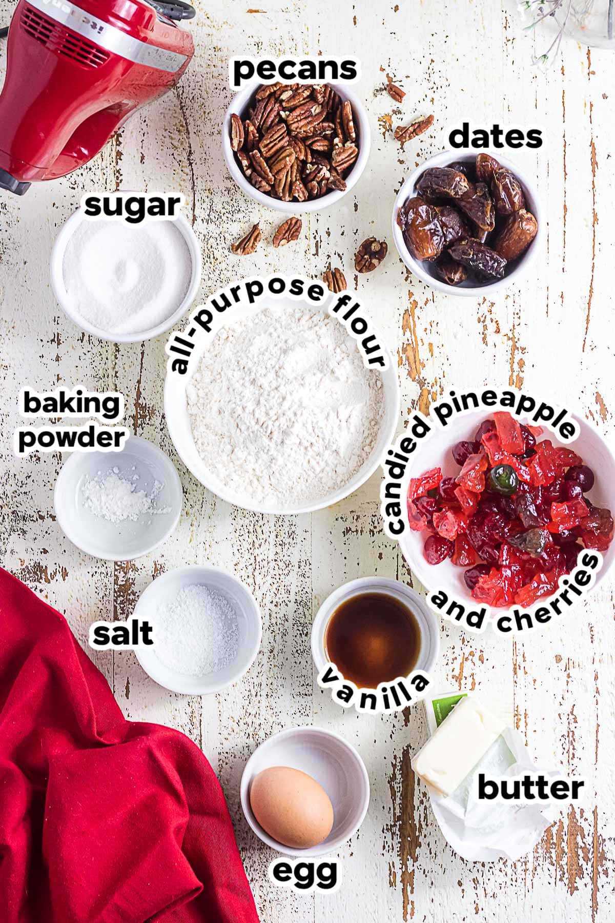 Ingredients for old-fashioned fruitcake cookies including butter, sugar, egg, flour, vanilla, dates, pecans, and candied cherries and pineapple.
